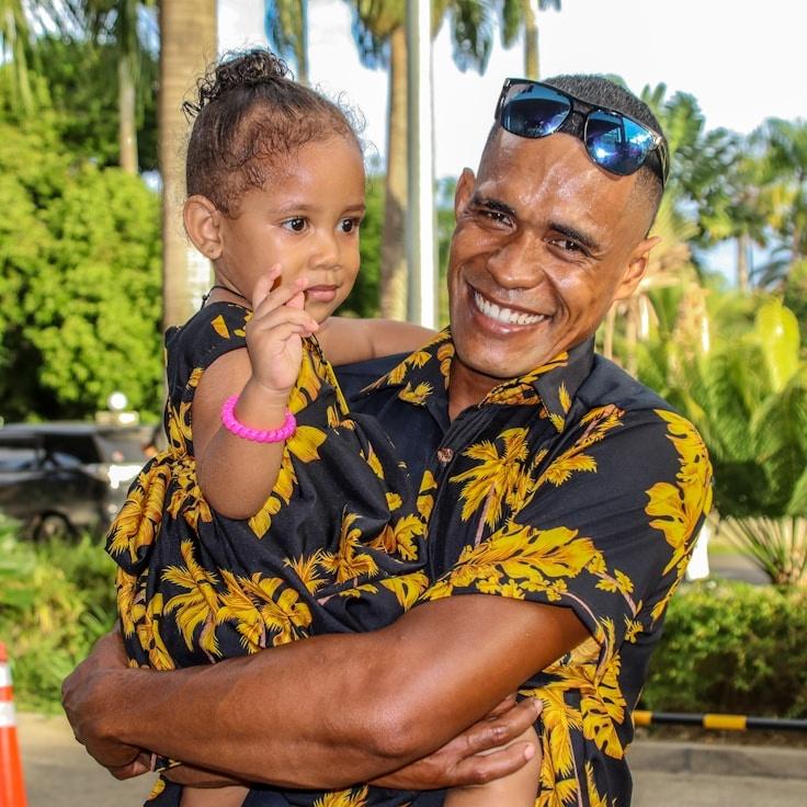 A team member, reviewing corporate floral arrangements